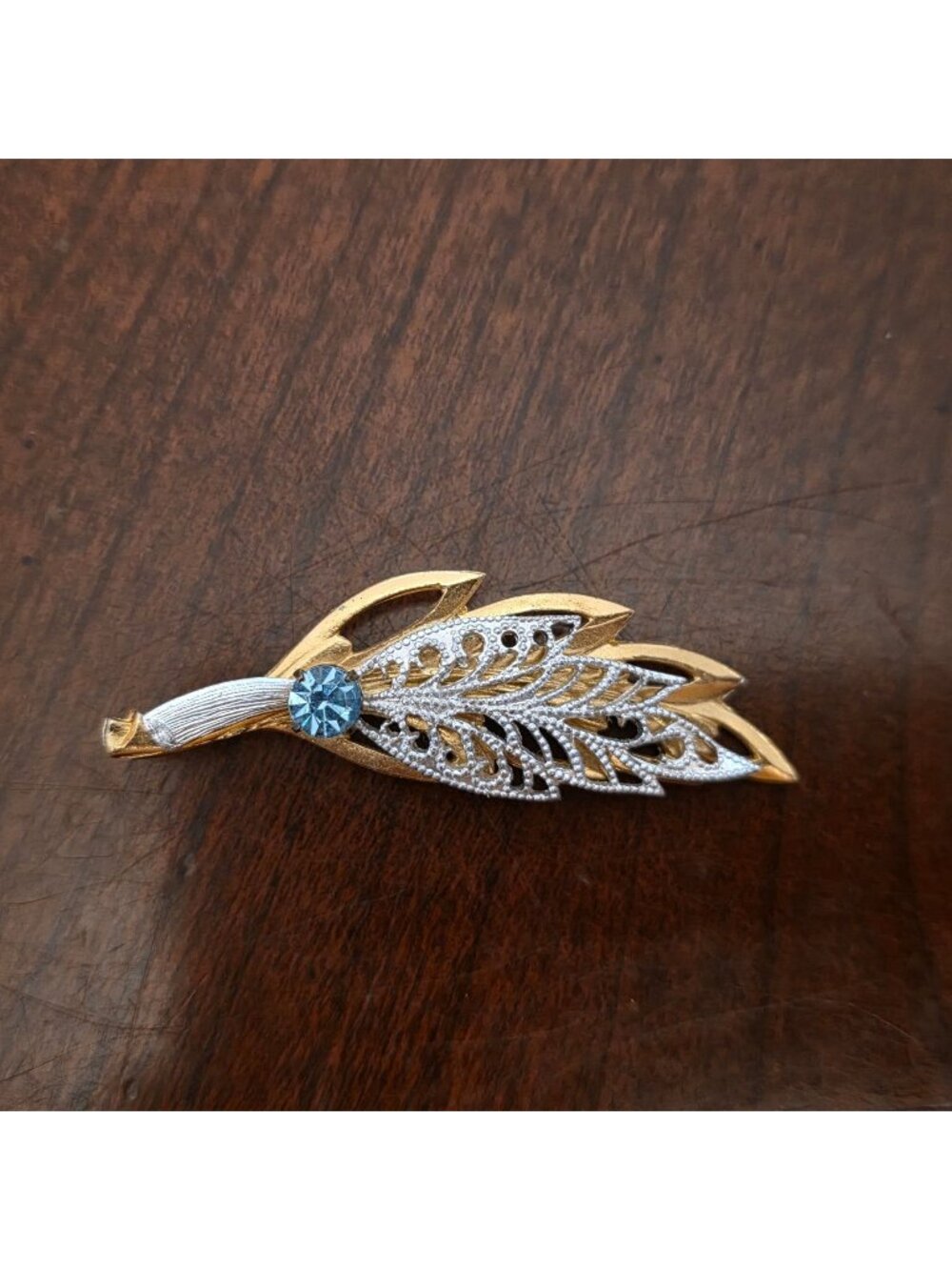 Vintage Gold-Tone Leaf Brooch With Blue Rhinestone & Filigree Design